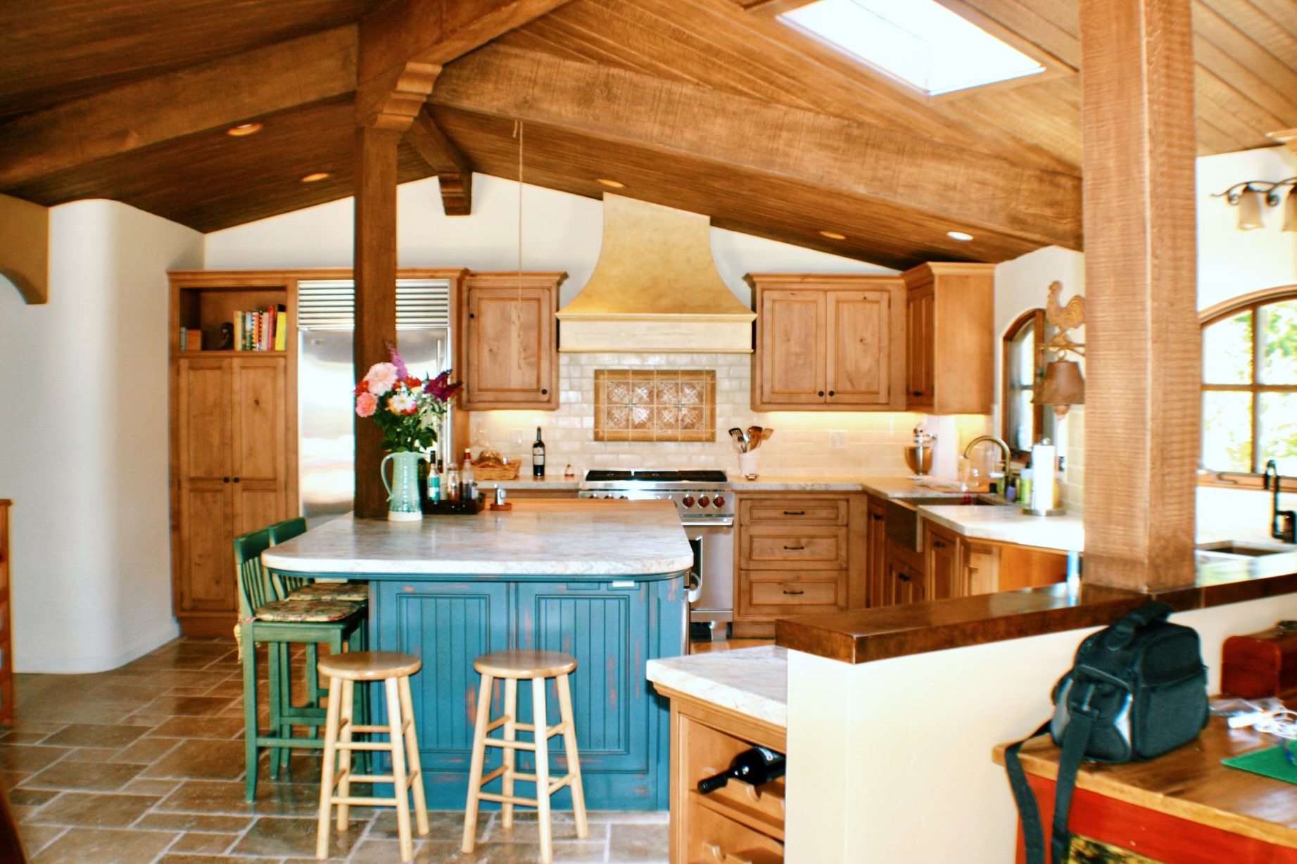 Kitchen with multi colored cabinets
